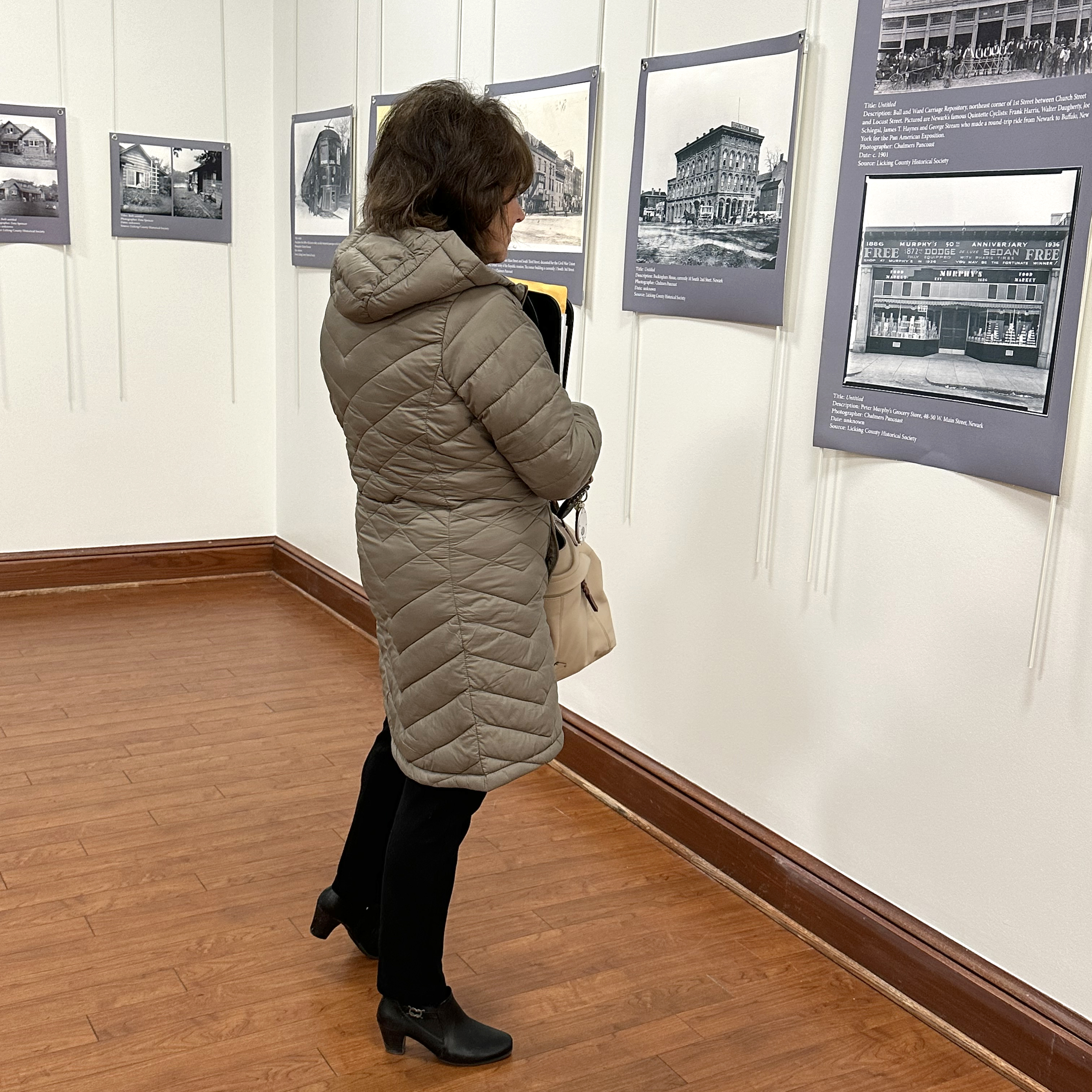 lady looking at artwork in The Collective
